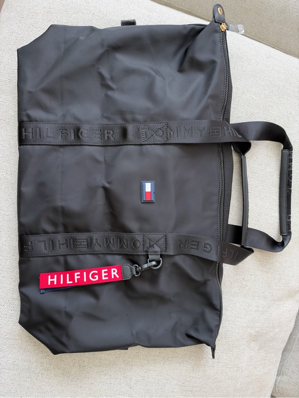 Tommy Hilfiger Black Duffel Bag with Red Tag and Flag Detail